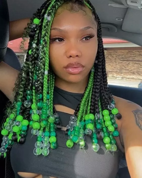 What are some tips for achieving a trendy look with green hair and goddess braids?