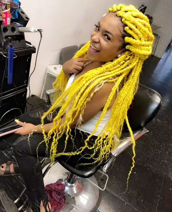 How can yellow hair be styled with goddess braids for a chic and versatile look?